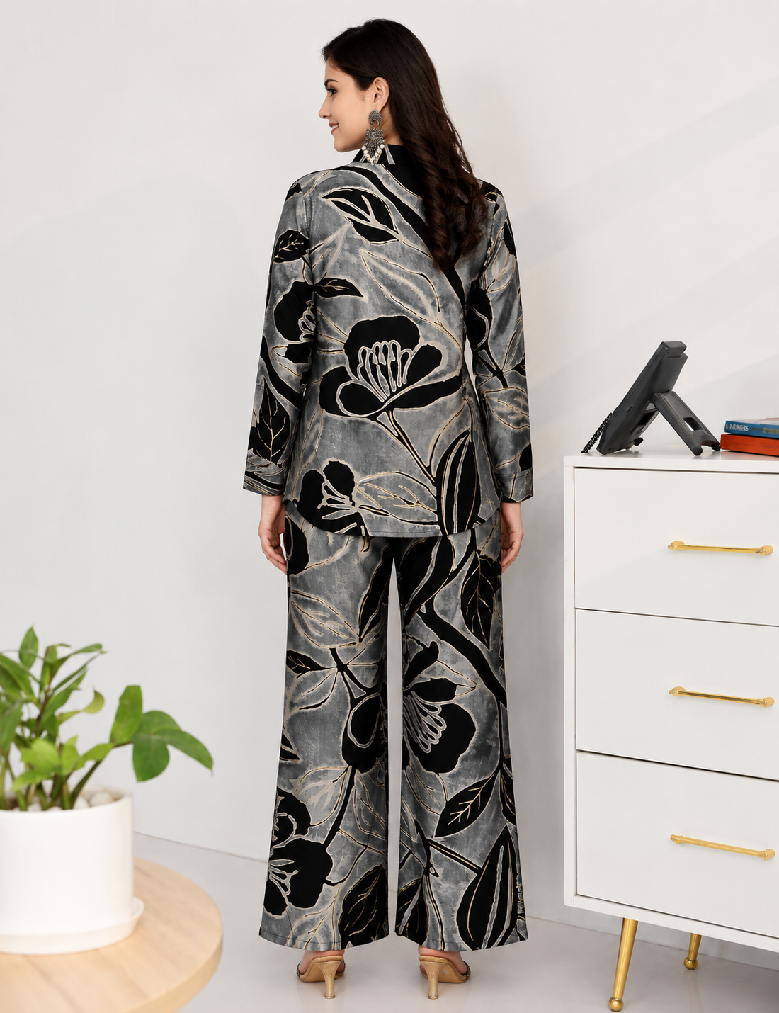 Woman styling Black Floral Printed co-ord set, lifestyle look, shirt and pants