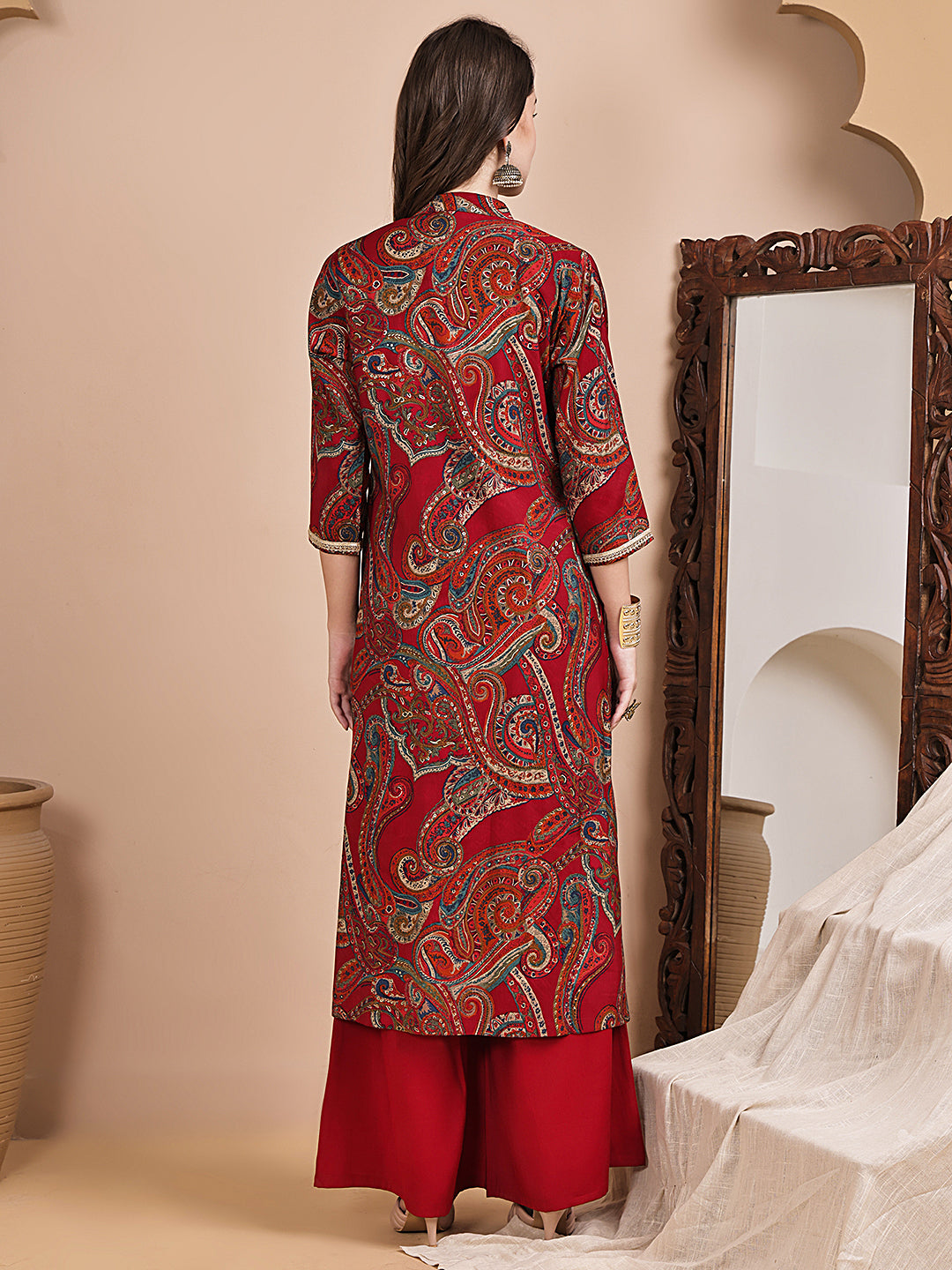 Back view of model styling red co-ord outfit