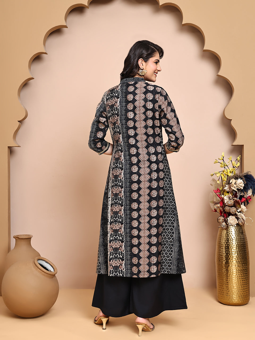 Back view of model styling Black 3-piece co-ord outfit