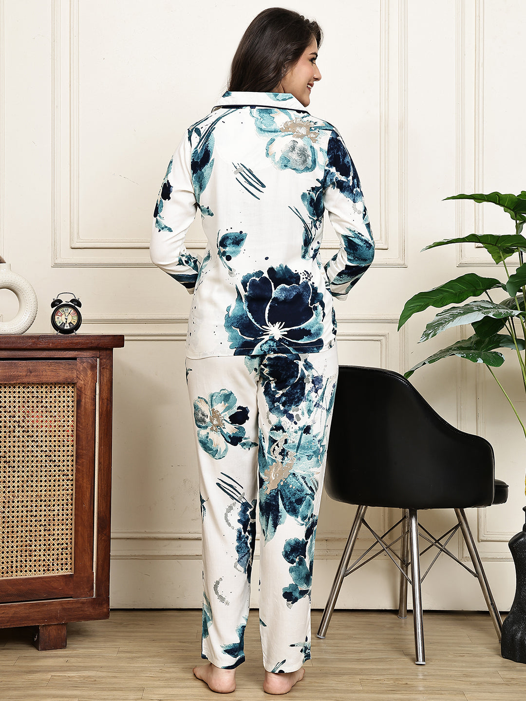 Back view of a model in a blue floral printed night suit