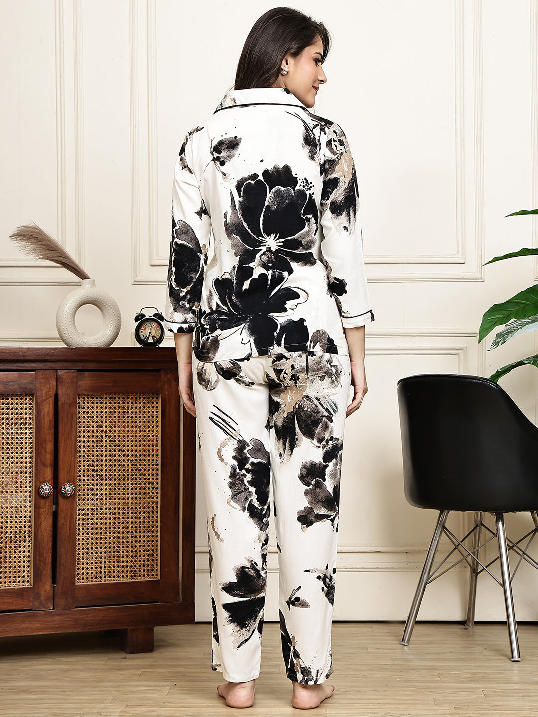 Back view of a model in the black floral printed night suit