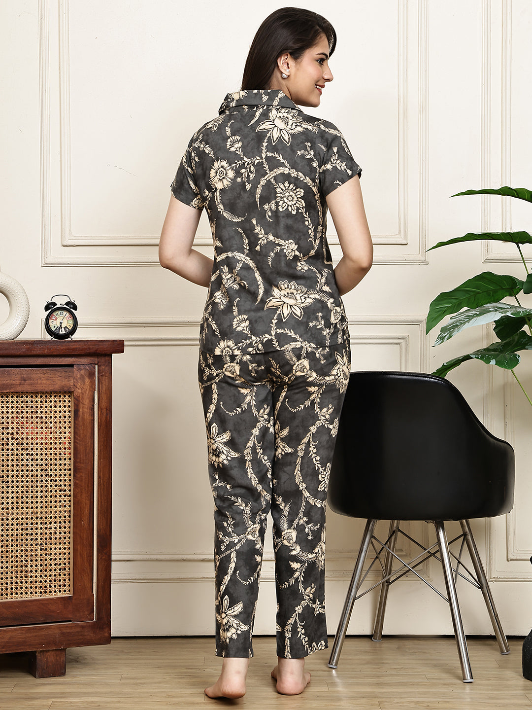 Back view of a model in the grey floral printed night suit