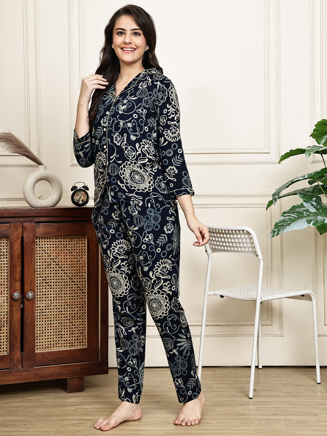 Back view of a model in the black printed Claura night suit.