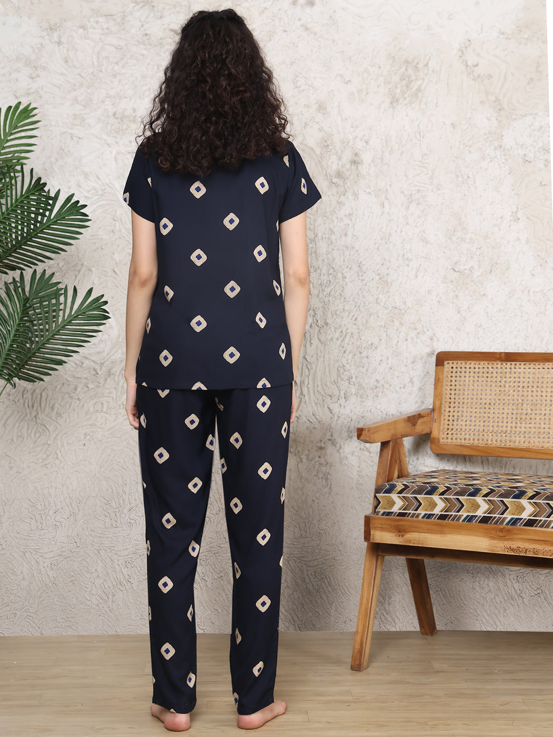 Back view of model in navy blue abstract printed night suit