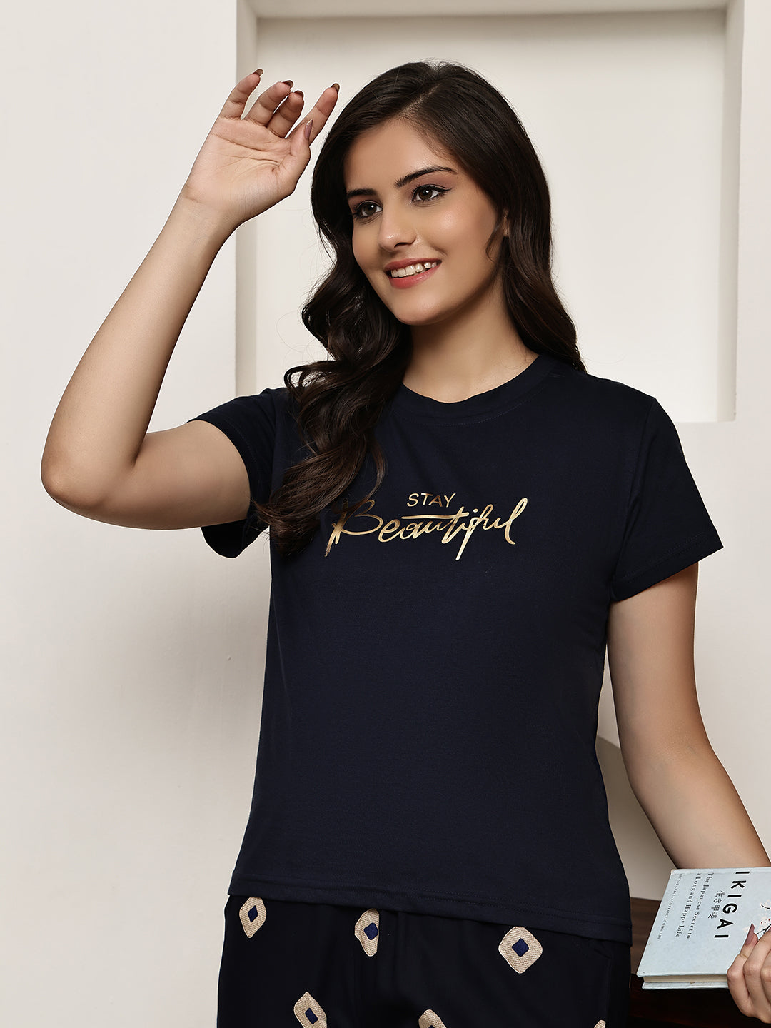 Lifestyle shot of Printed Cotton Night Suit for Women relaxing on a couch