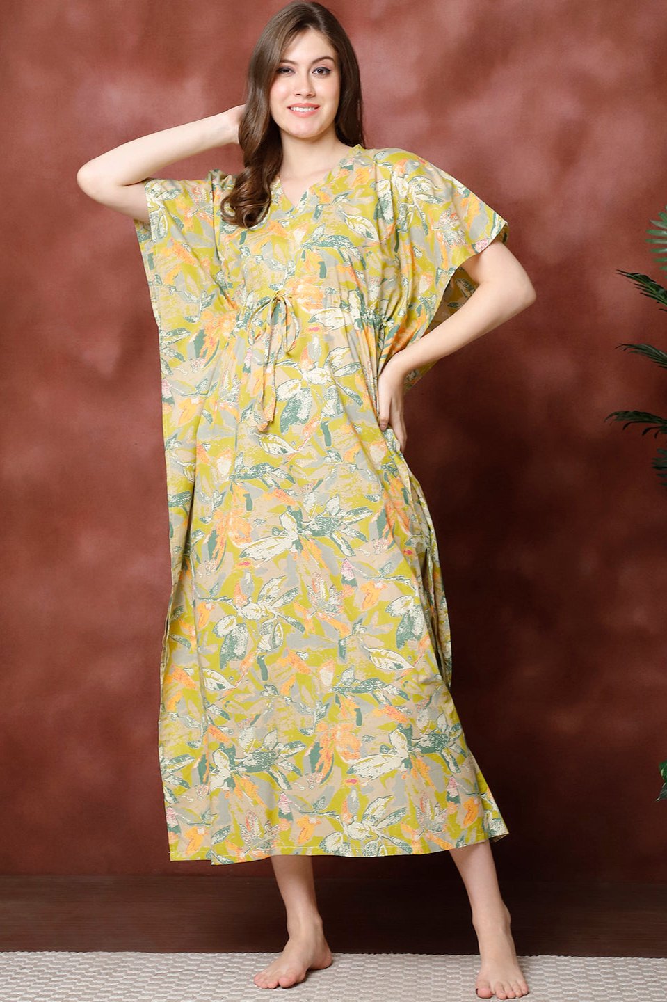 Woman wearing green floral printed Kaftan Dress