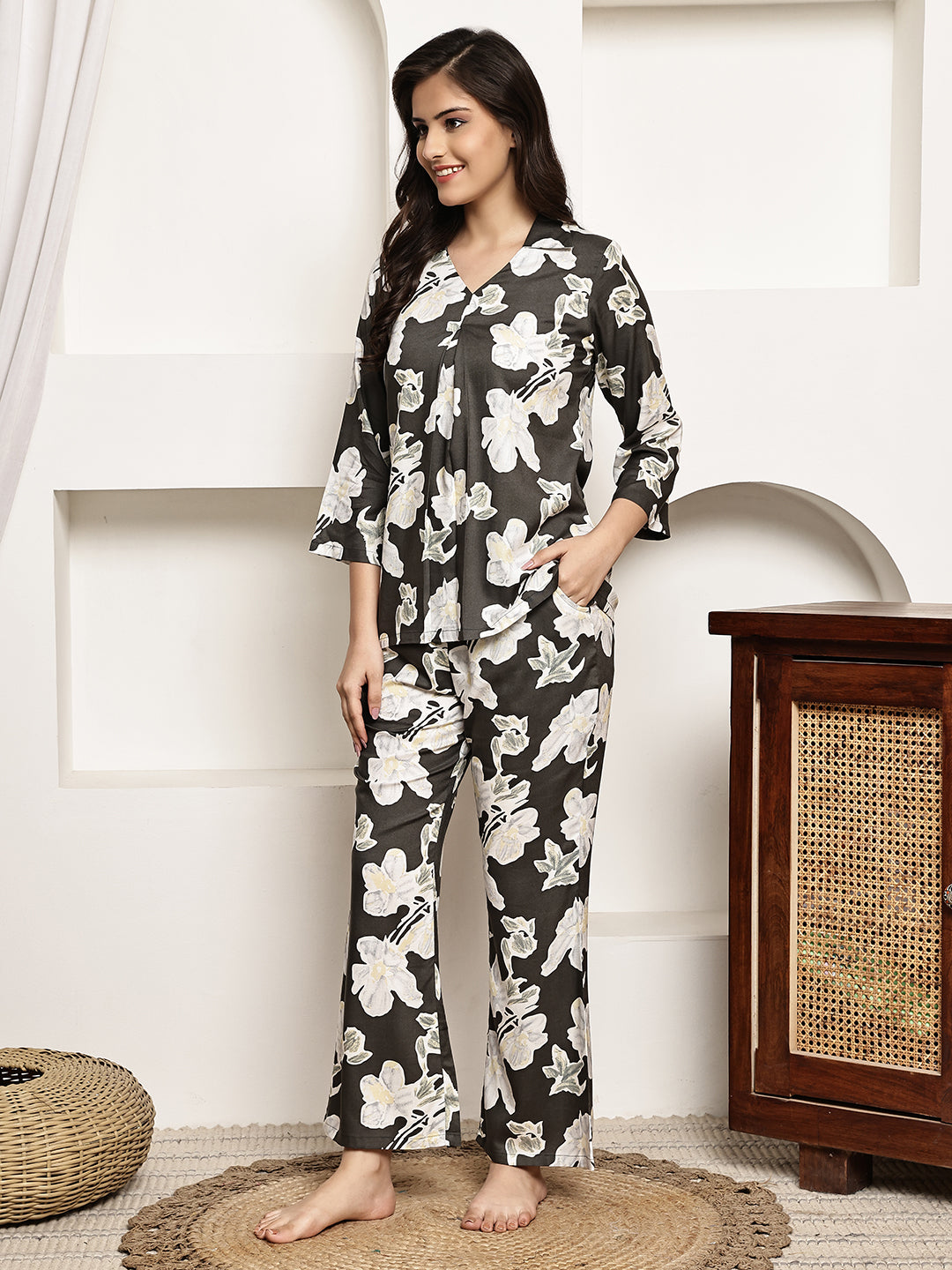 Lifestyle shot of Abstract Night Suit for Women lounging on a couch
