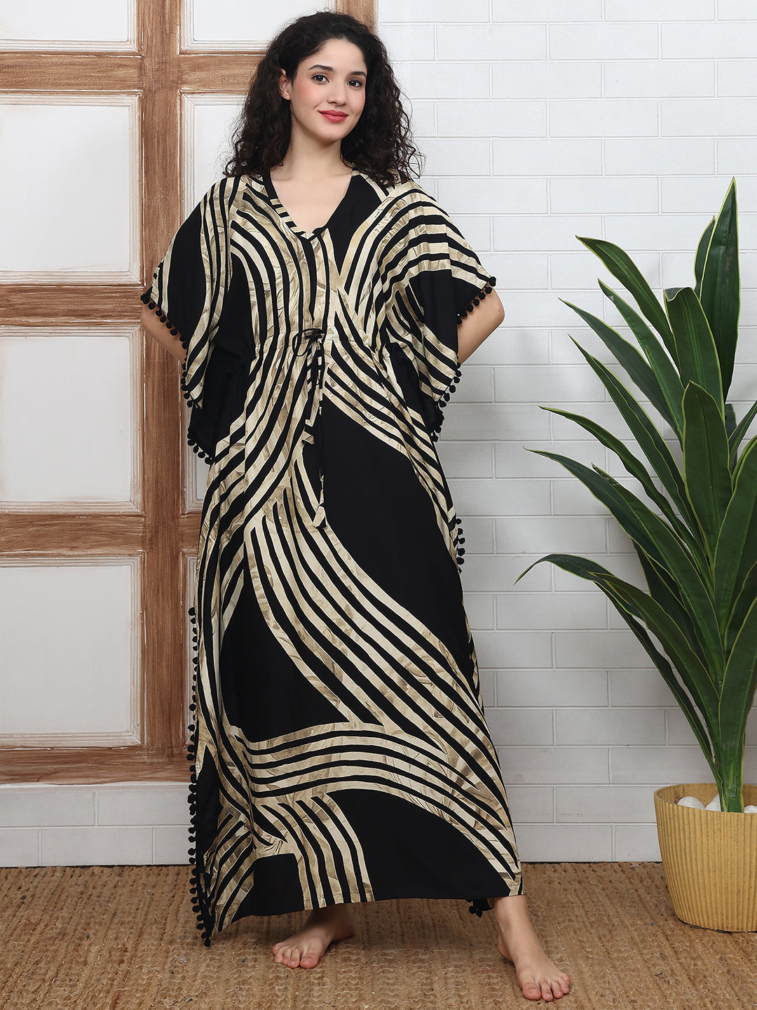 Woman wearing black abstract printed Kaftan Dress