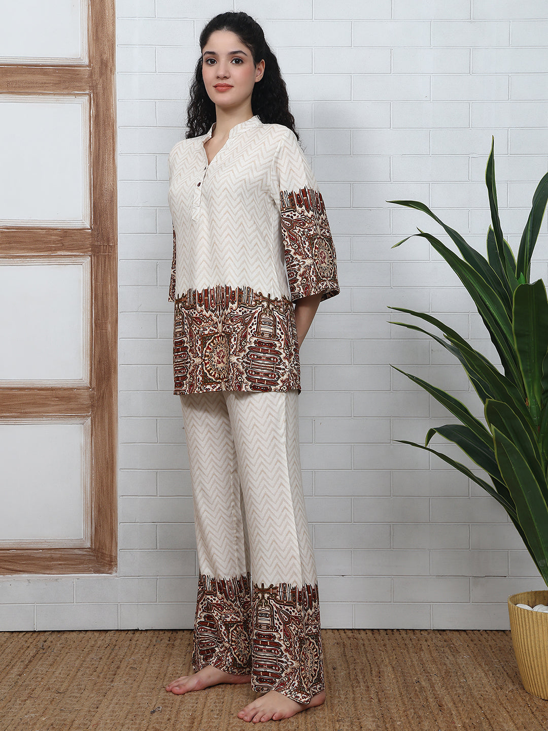 Woman wearing white abstract printed night suit