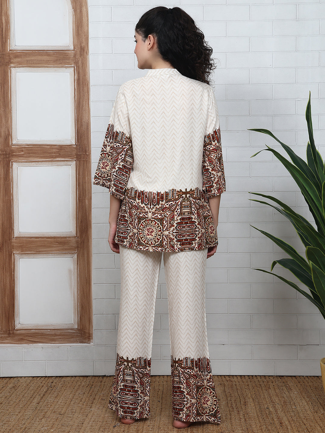 Back view of model in white printed night suit