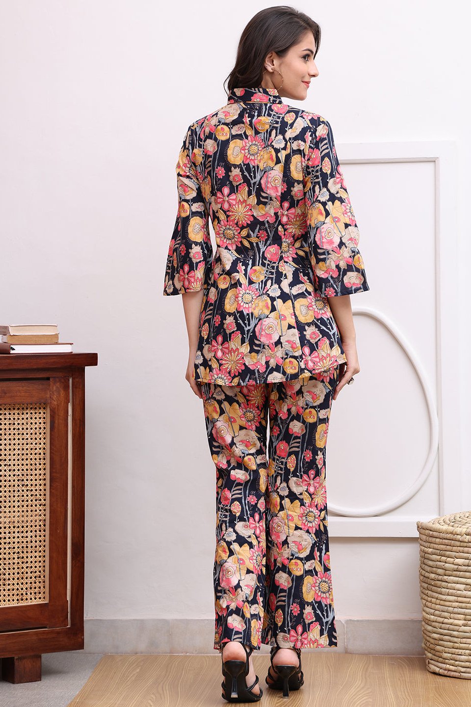 Back view of model styling navy co-ord outfit