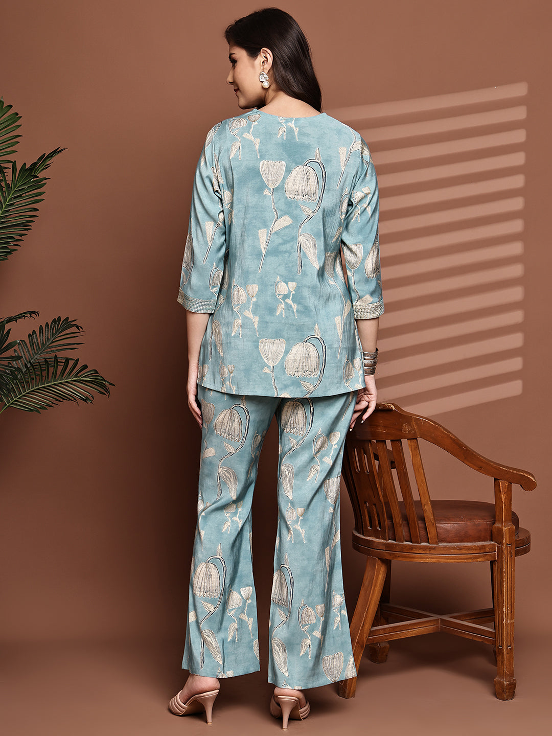 Back view of model styling light blue floral co-ord outfit