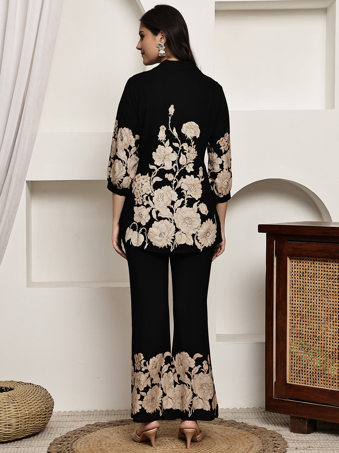 Back view of model styling black floral co-ord outfit