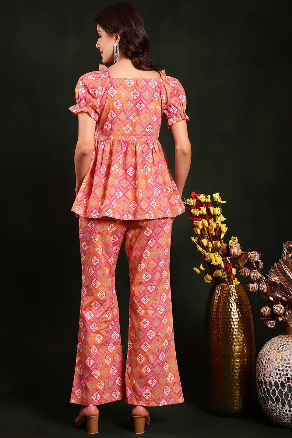 Back view of model styling pink floral co-ord outfit