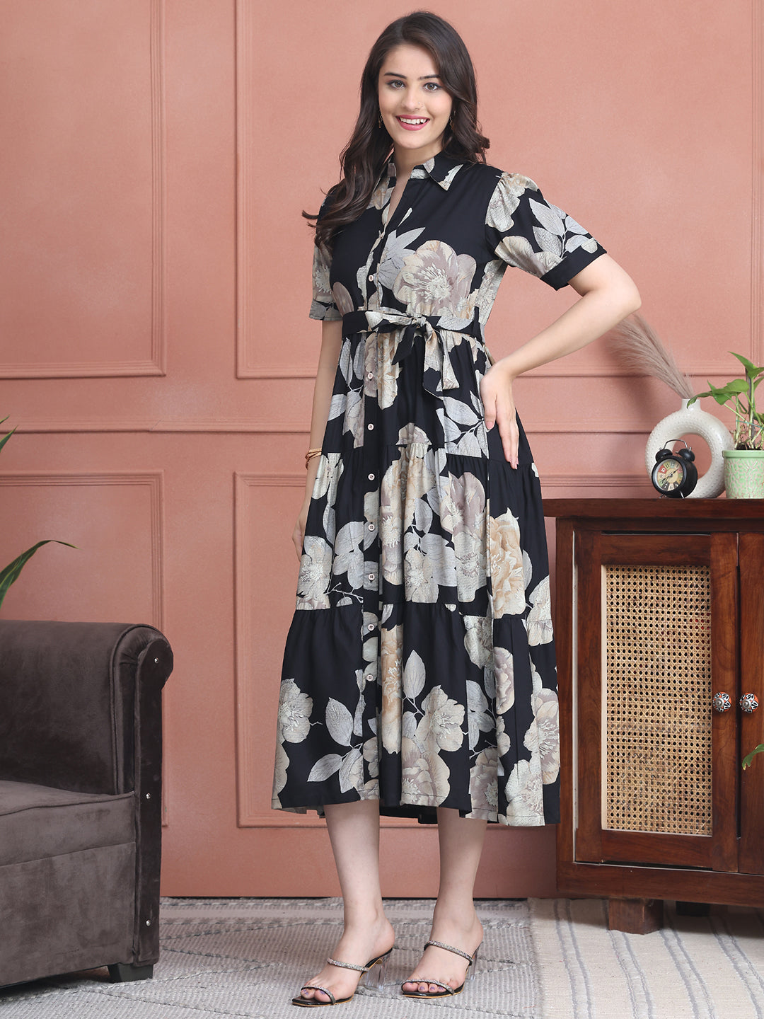 Lifestyle shot of floral printed black viscose dress