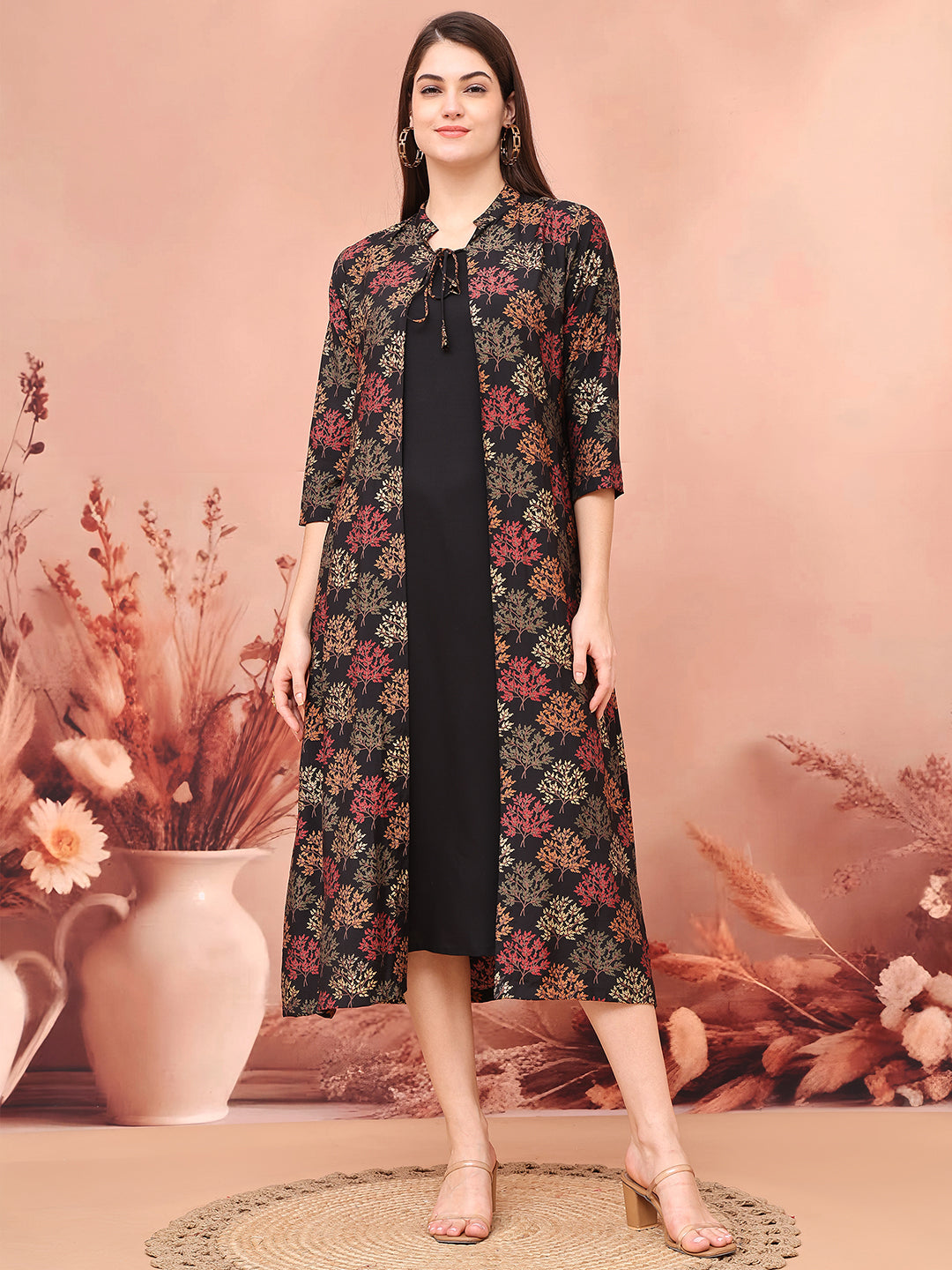 Woman wearing black abstract printed dress
