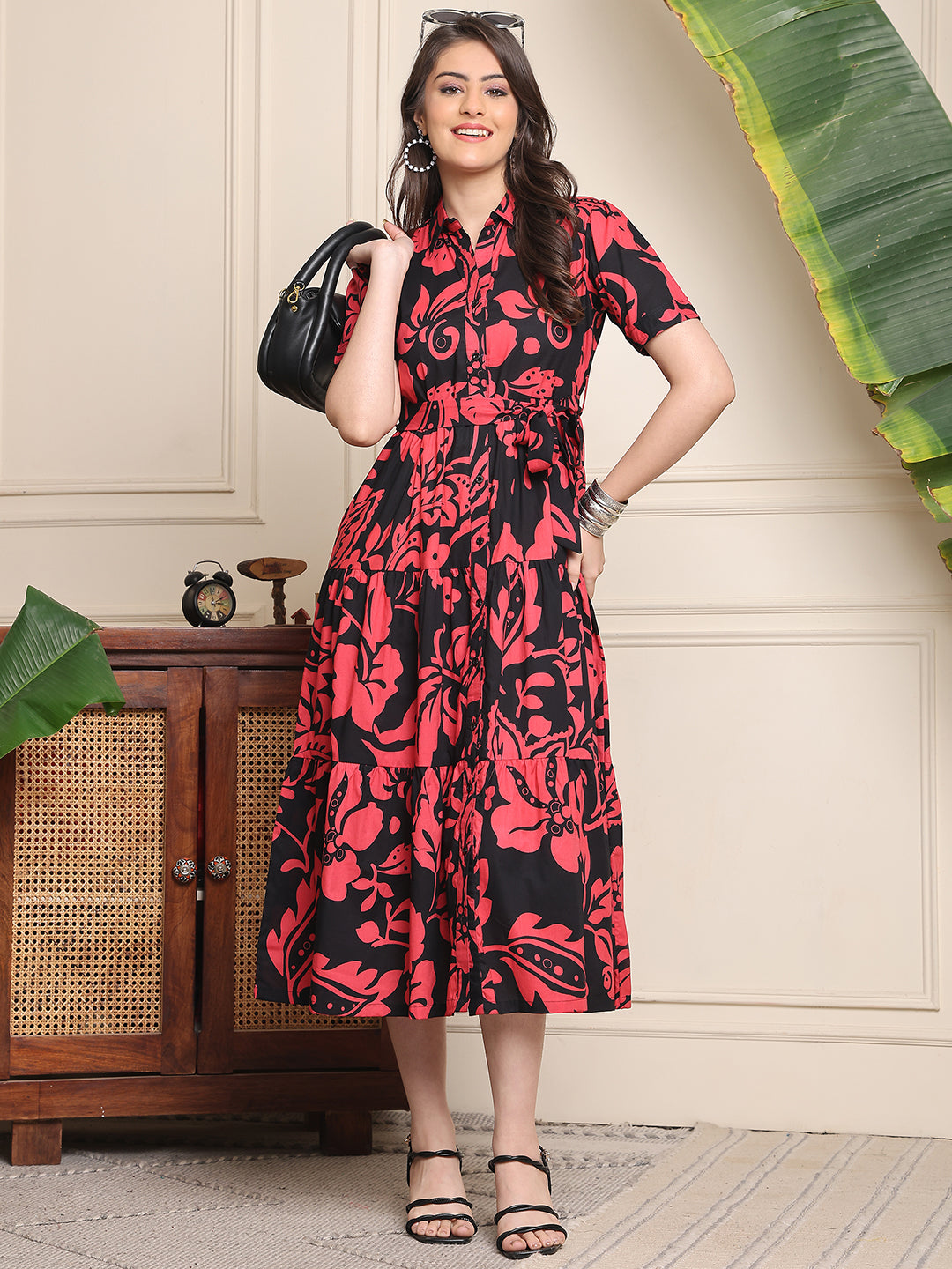 Woman wearing black floral printed dress