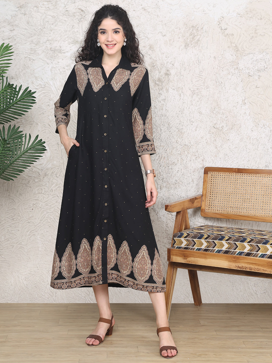 Woman wearing black ethnic motifs printed dress