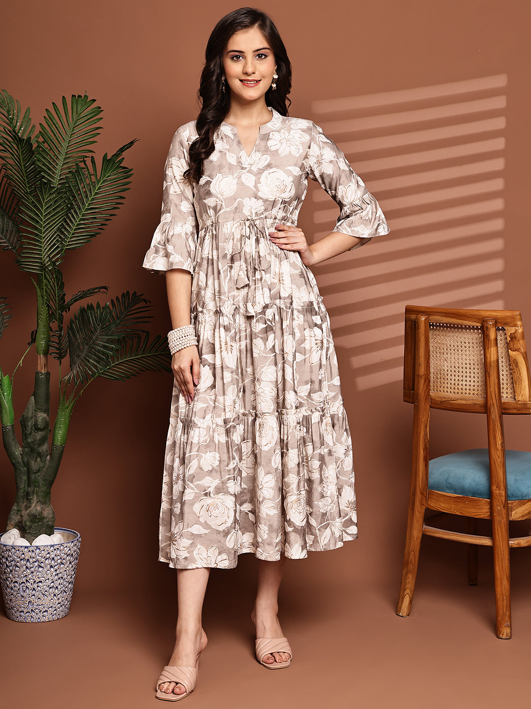 Woman wearing cream floral printed Chanderi dress