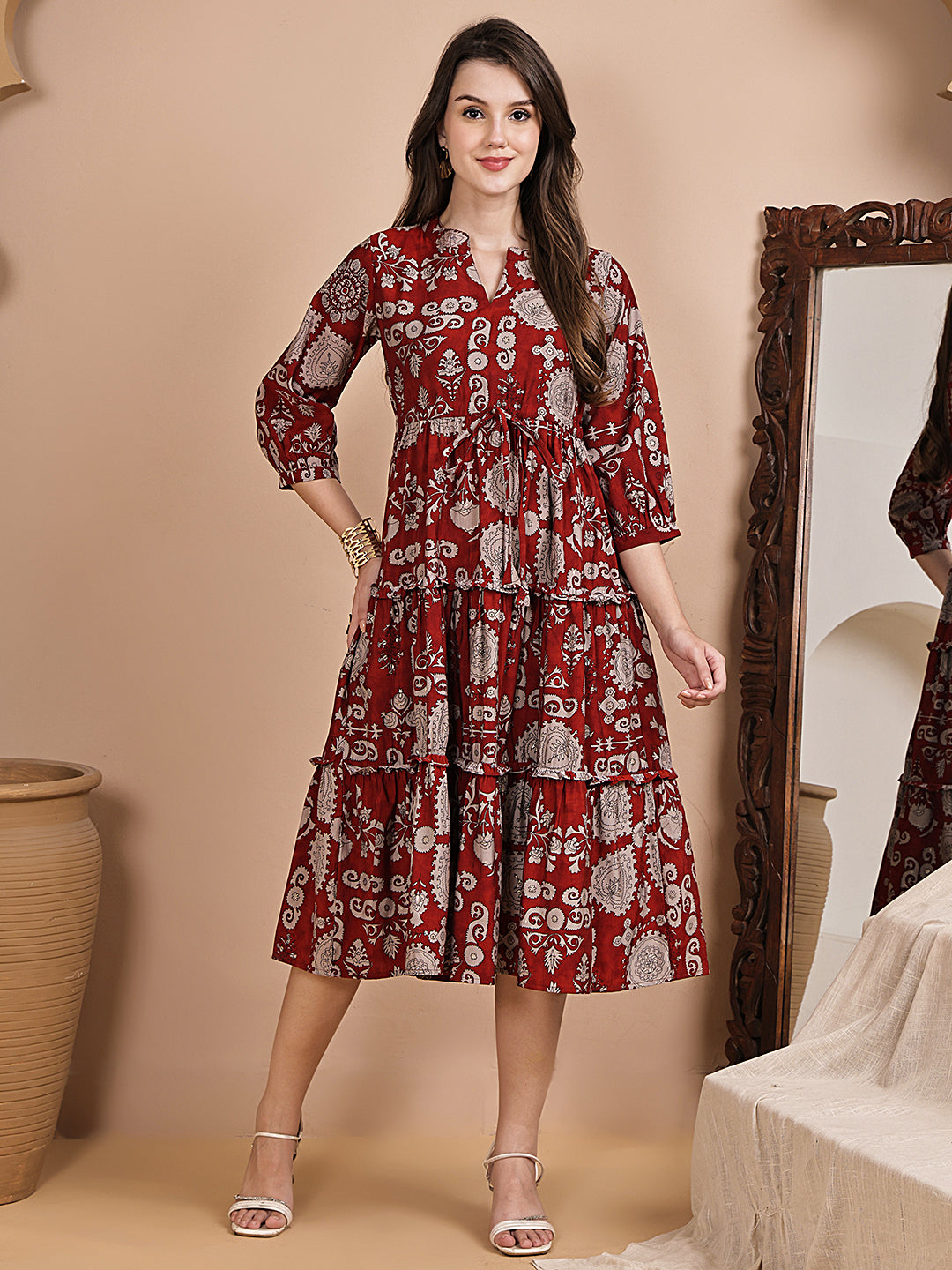 Woman wearing maroon floral printed dress