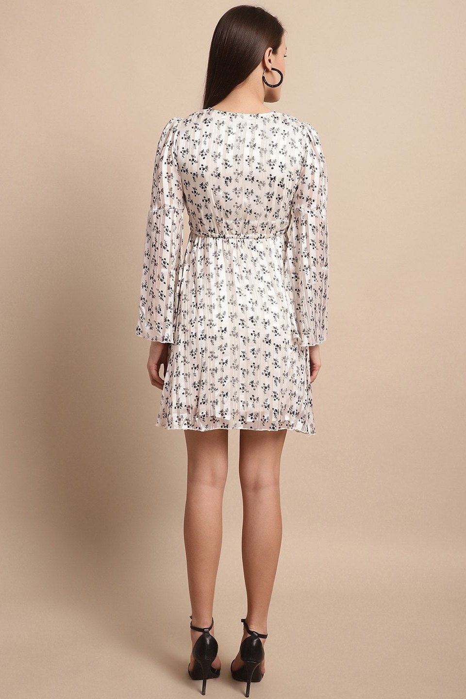 Back view of model in white polyester dress