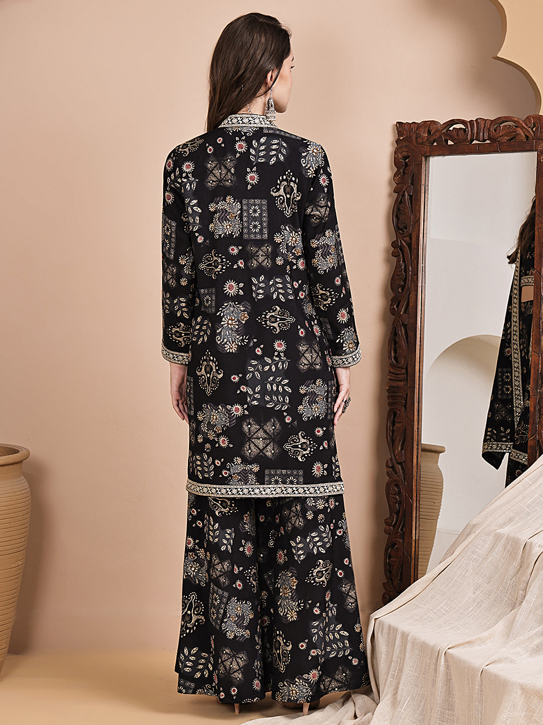 Back view of model styling black ethnic co-ord outfit