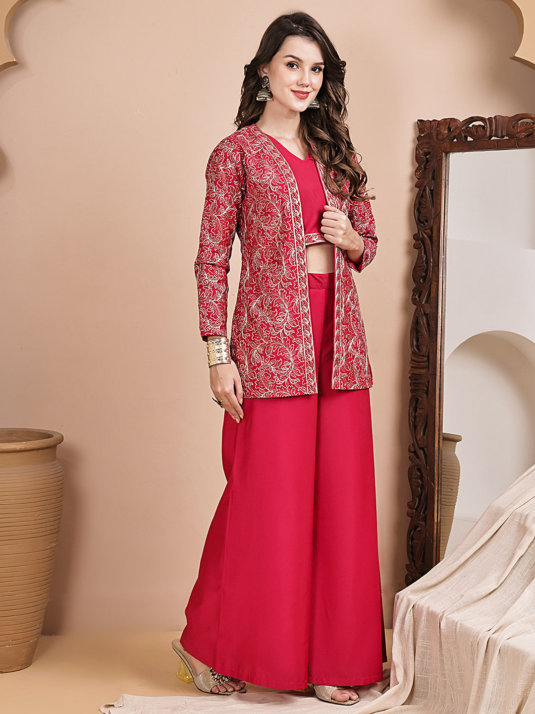 Woman wearing pink embroidered jacket co-ord set 