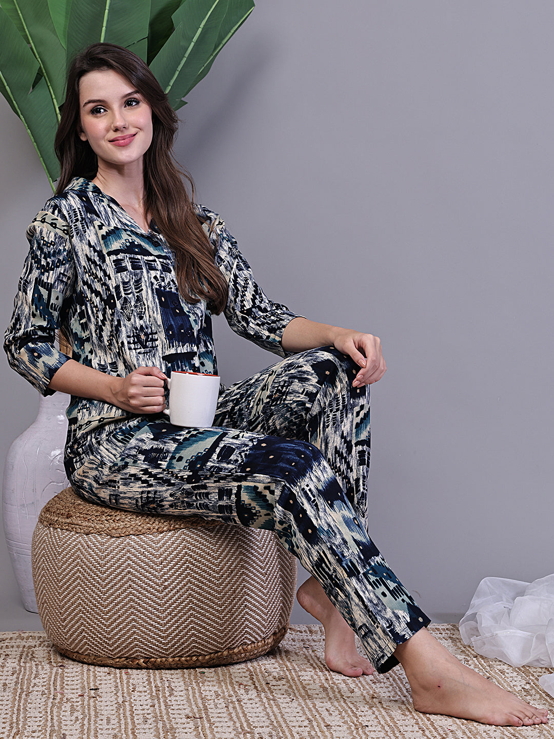 Lifestyle shot of Abstract Night Suit for Women relaxing