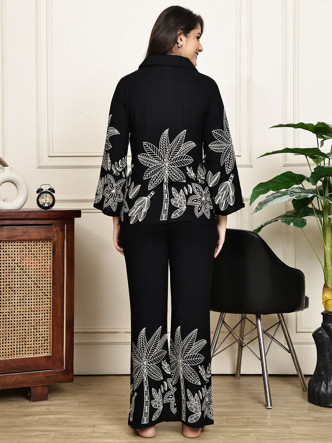 Back view of a model in the black abstract printed night suit