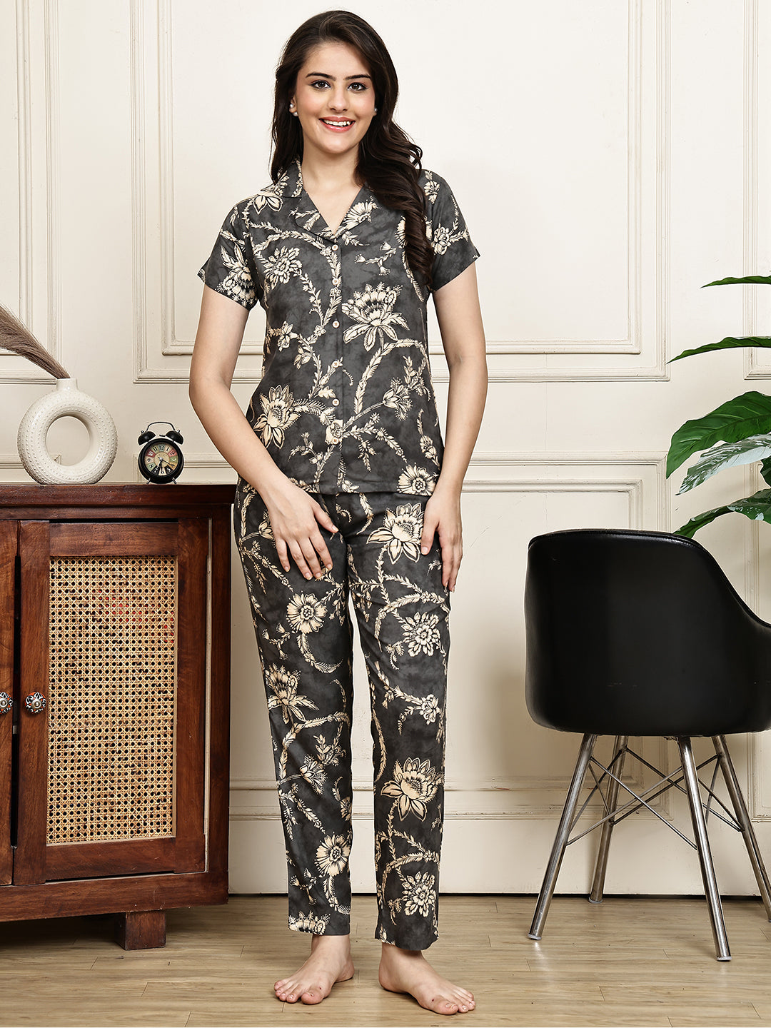 Woman wearing a grey floral night suit 