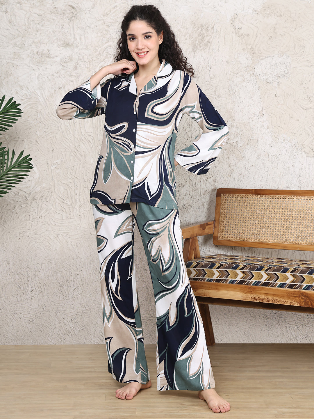 Woman wearing a blue abstract print night suit