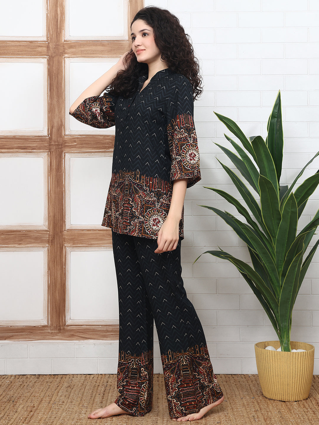 Lifestyle shot of model in Black abstract co-ord outfit for day wear