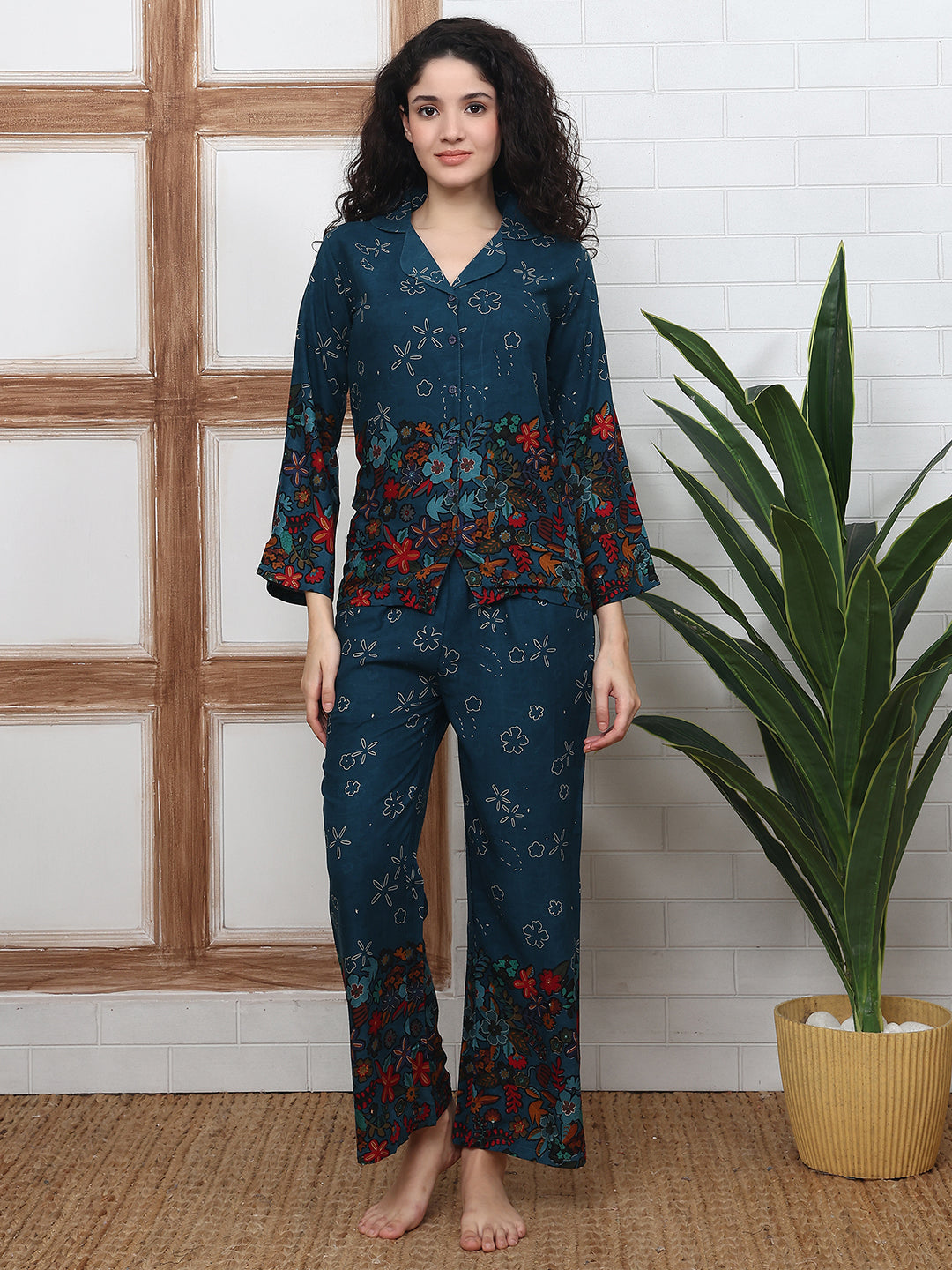 Woman wearing Teal Blue Floral Night Suit