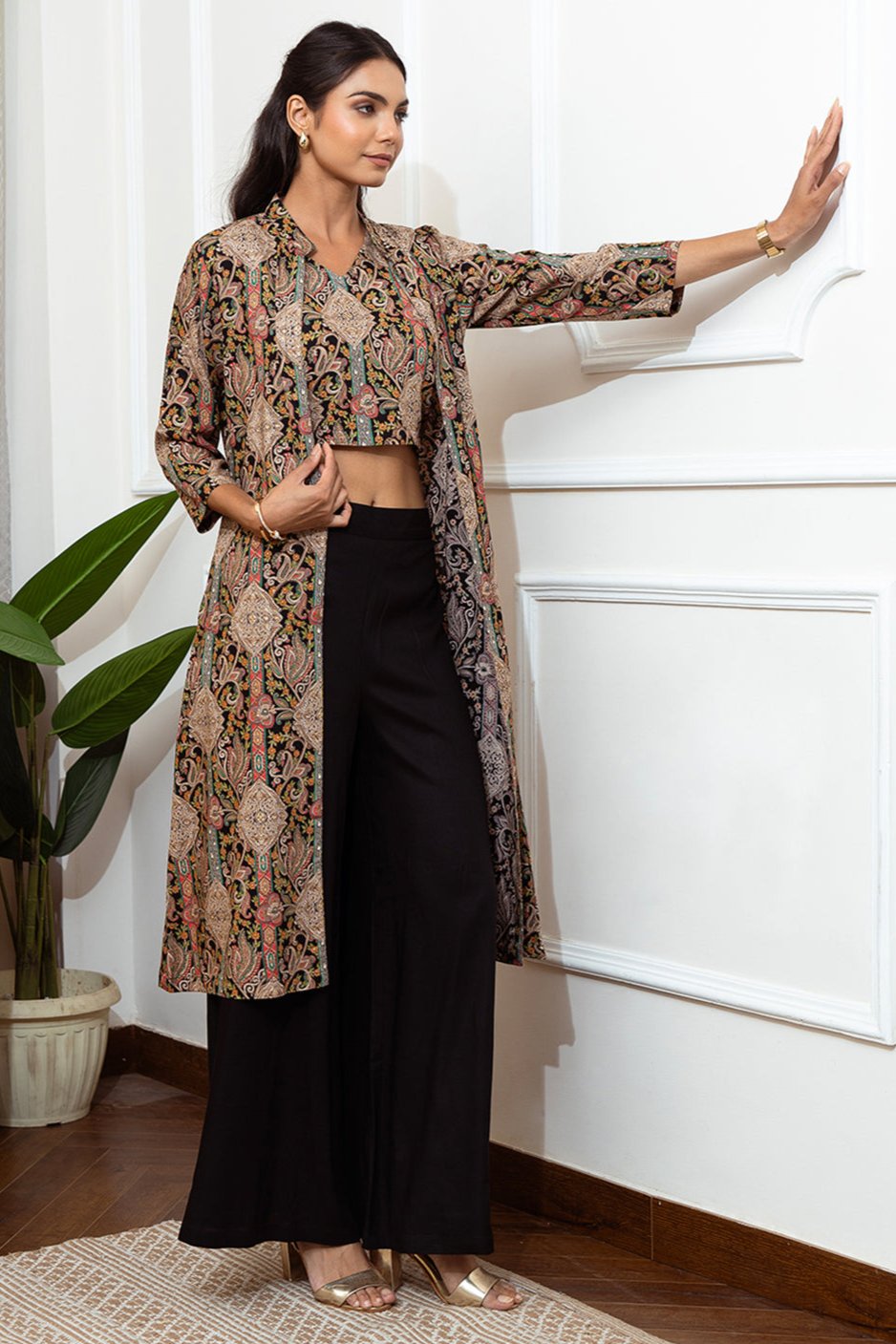 Back view of model styling black co-ord outfit