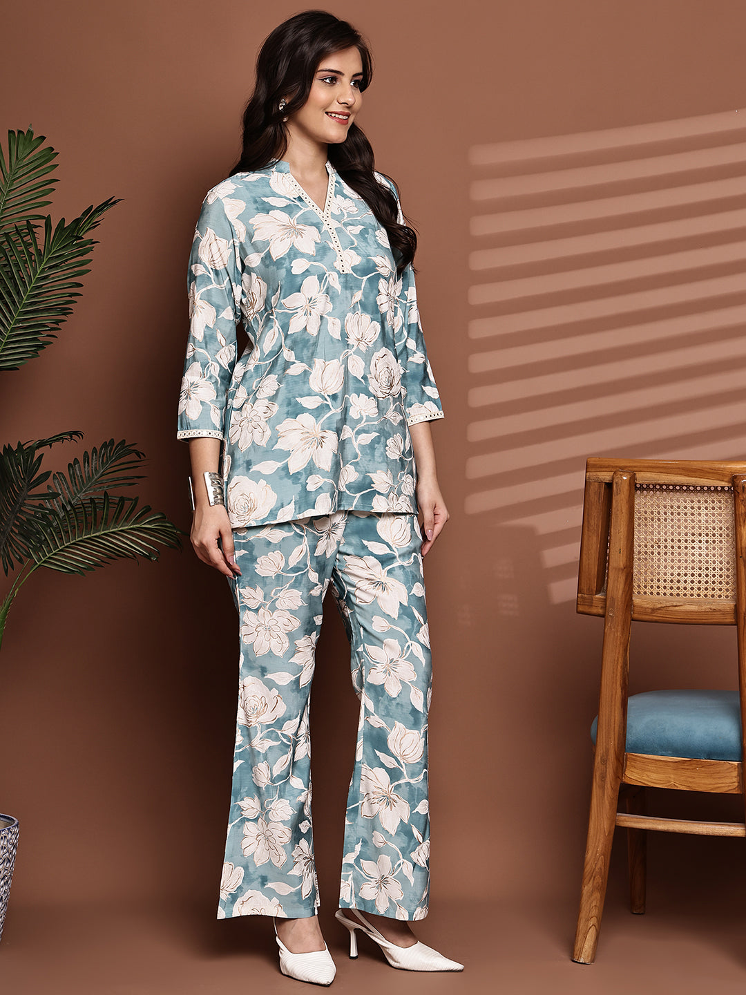 Back view of model styling blue floral co-ord outfit