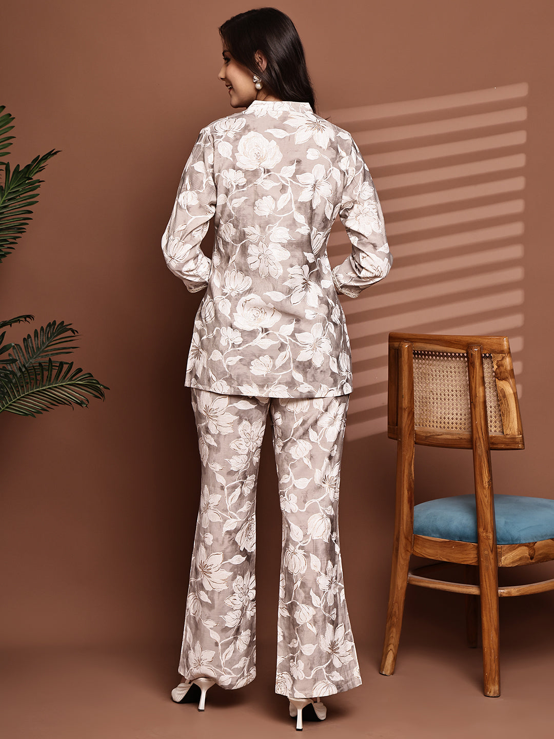 Back view of model styling light-colored co-ord outfit
