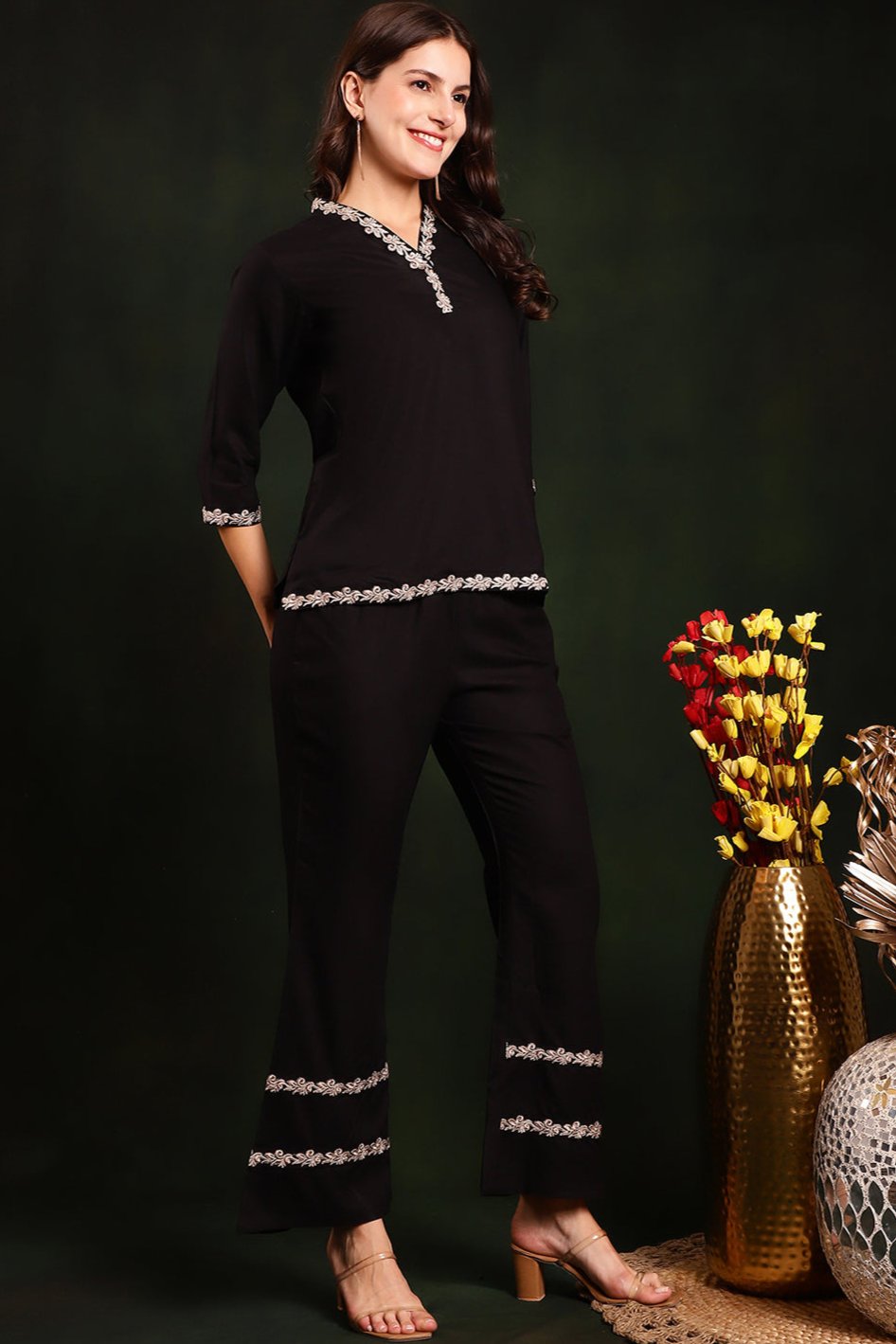 Back view of model styling black co-ord outfit