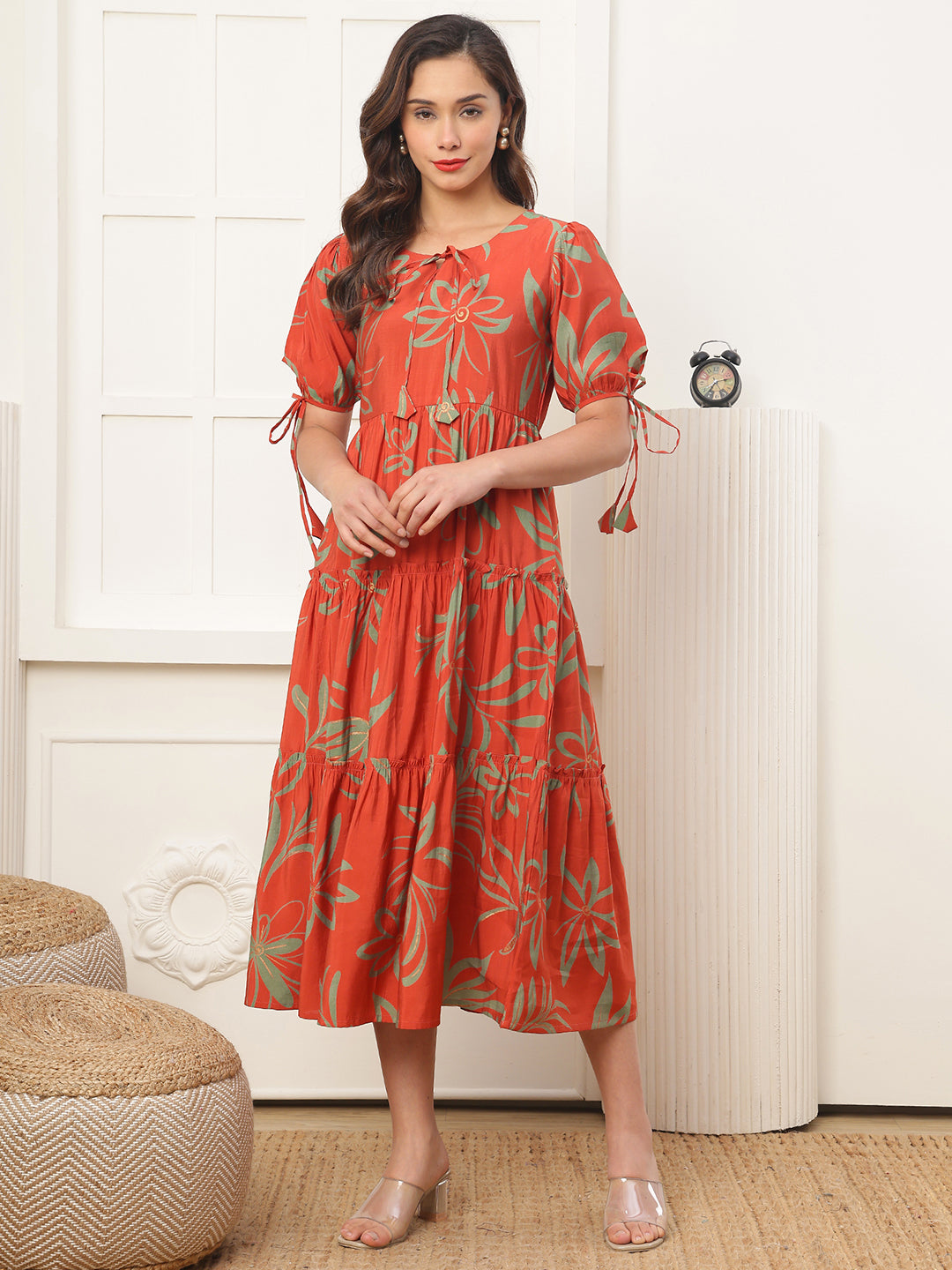Woman wearing orange floral dress