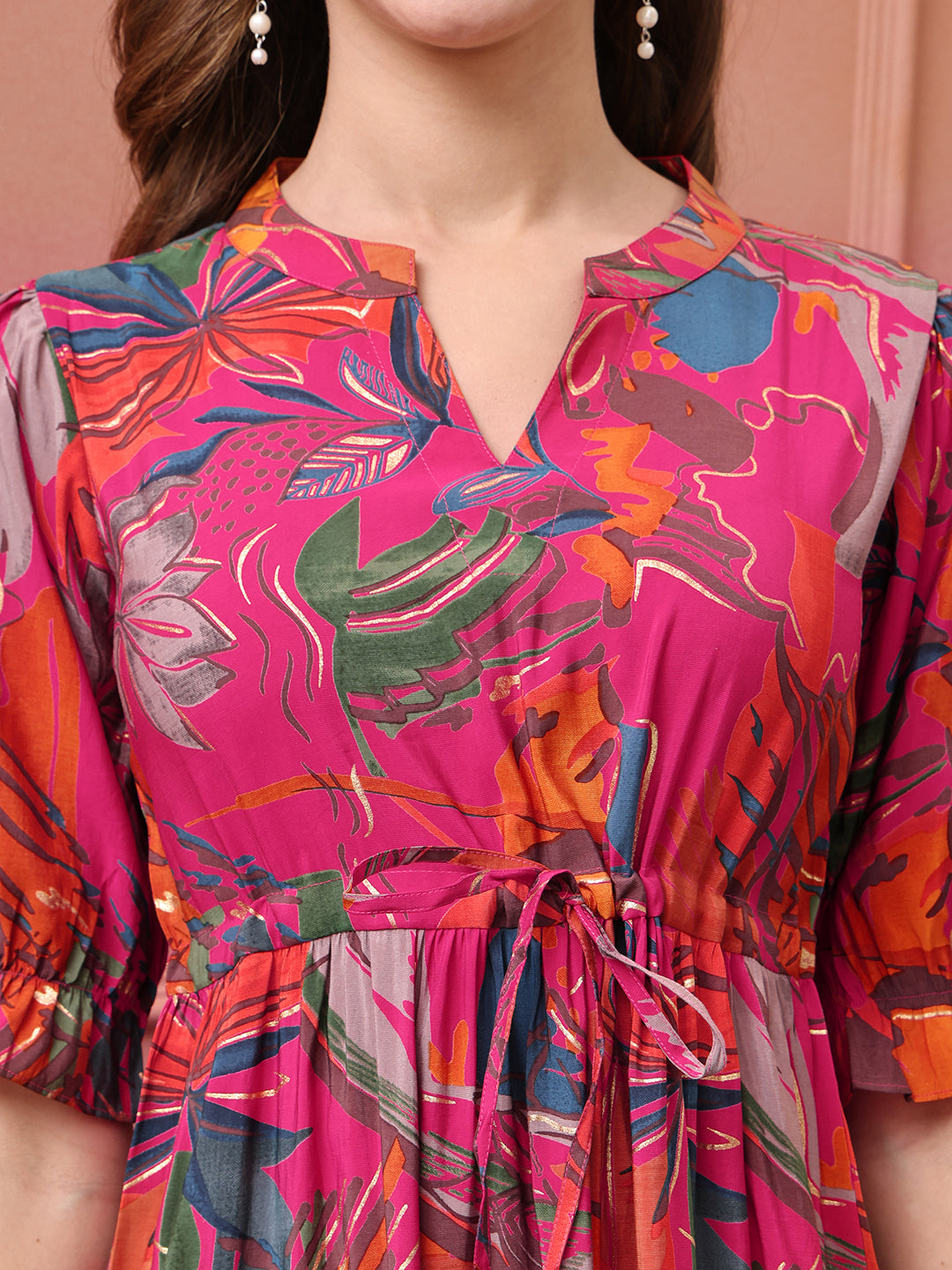 Close-up of premium Chanderi fabric on pink dresses for women