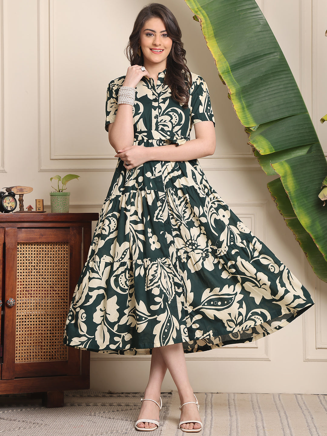 Woman wearing green floral printed cotton dress