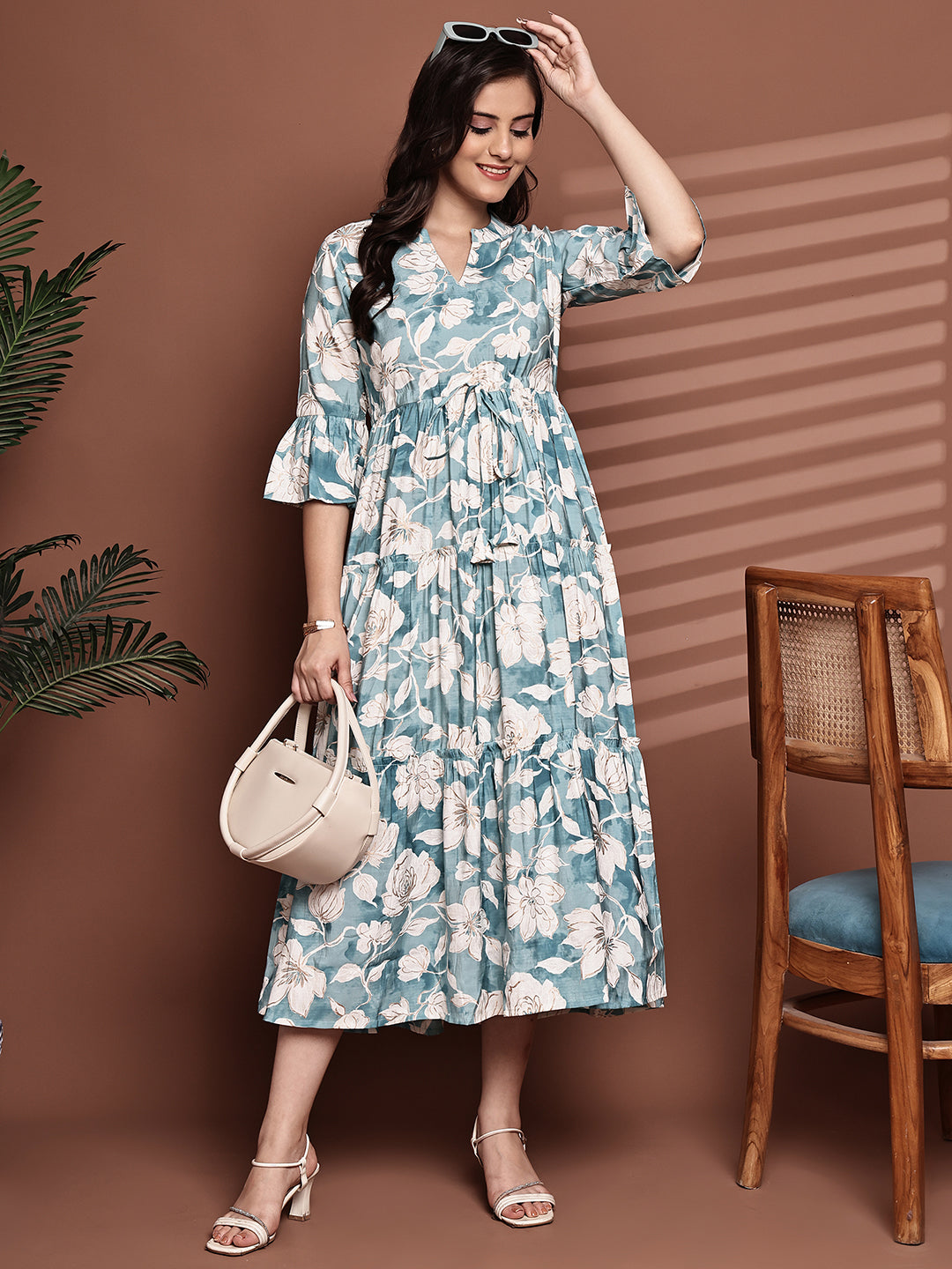 Woman wearing blue floral printed dress