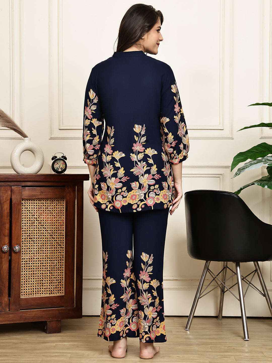 Back view of model in navy blue printed Night Suit