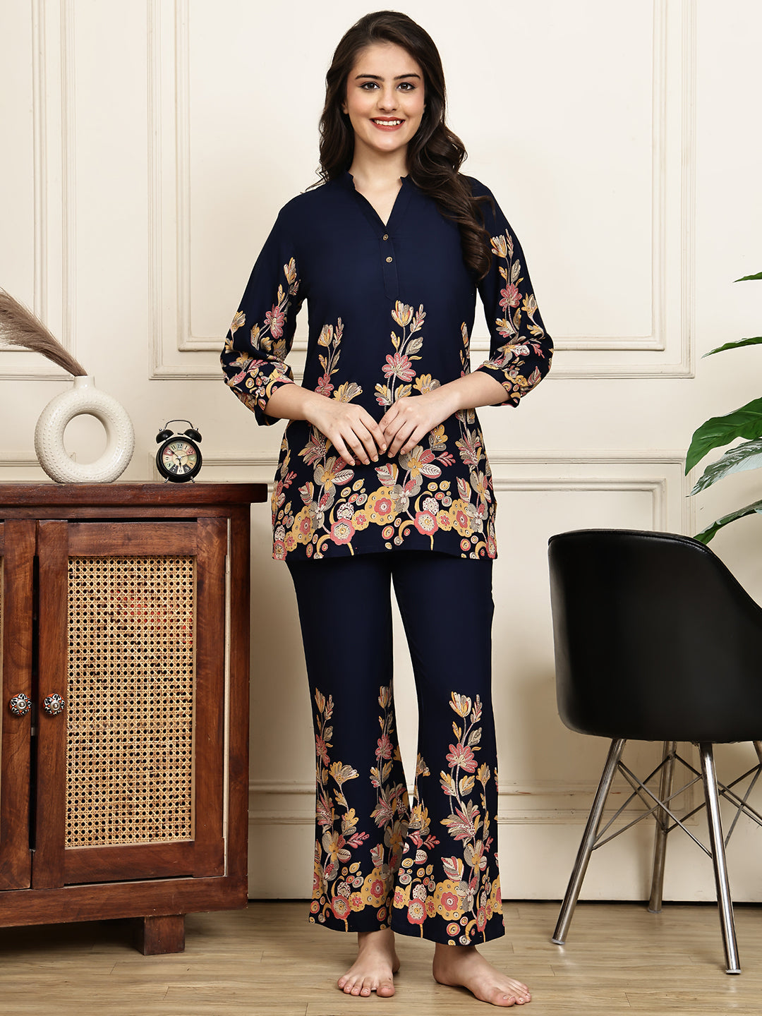Woman wearing navy blue floral printed Night Suit