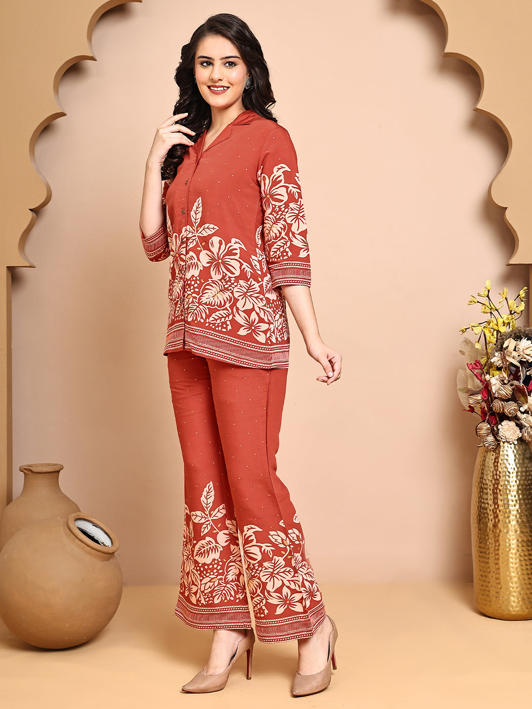 Back view of model styling Orange floral co-ord outfit