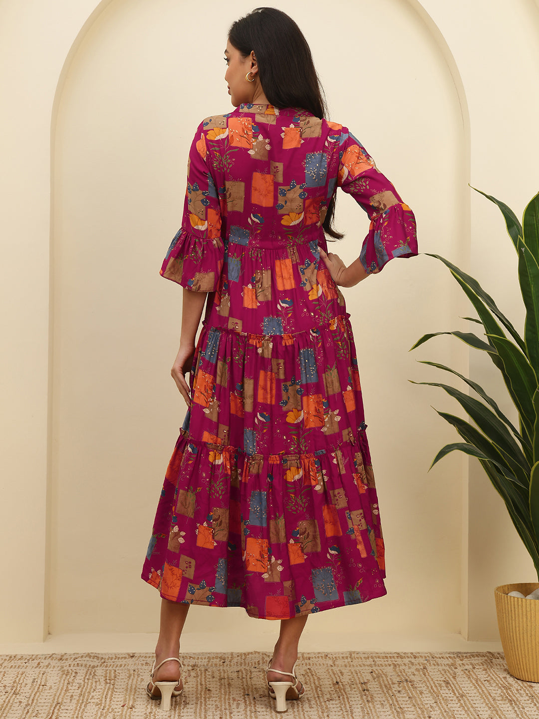 Back view of model in Magenta Printed Dresses