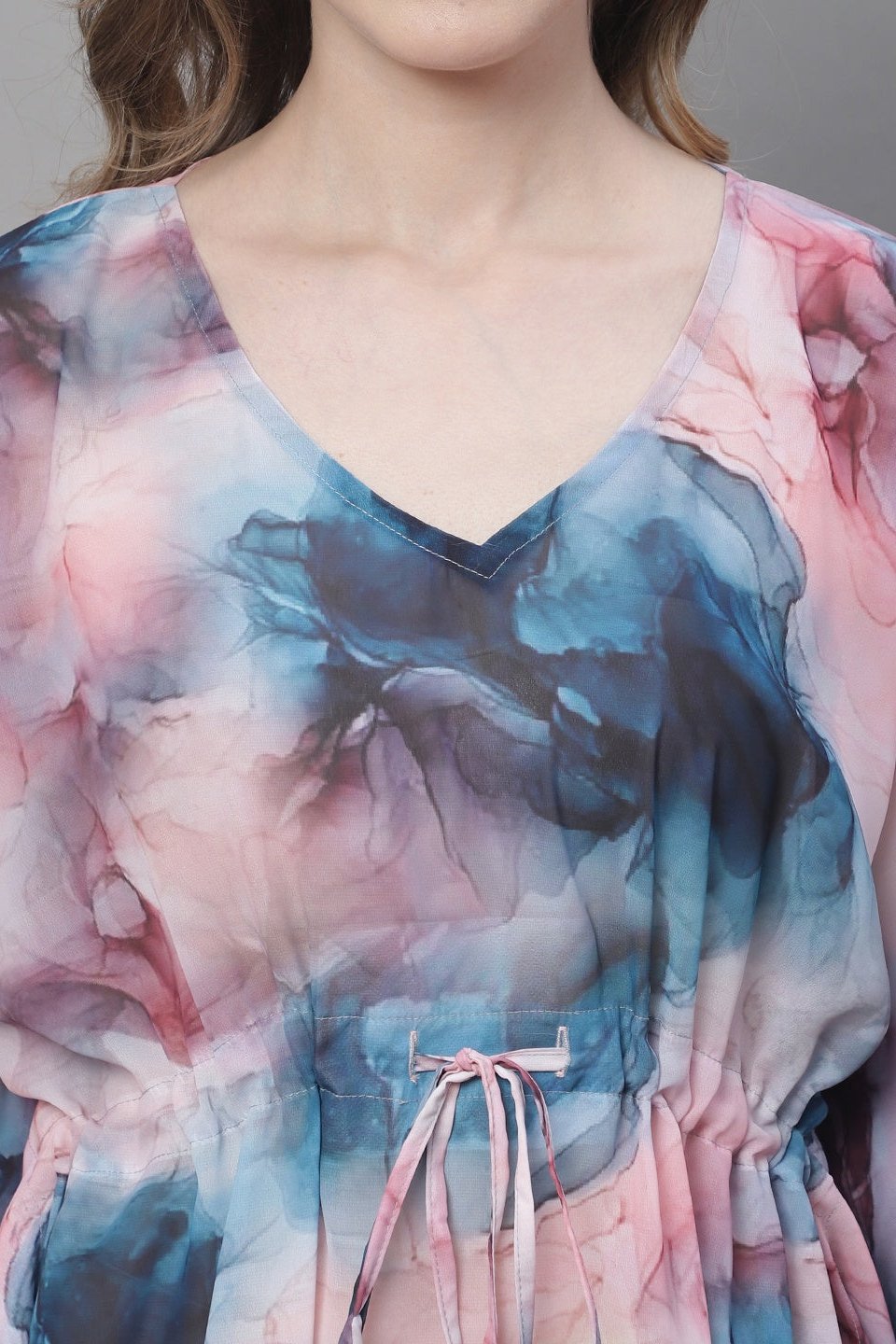 Close-up of georgette fabric on multi-color beach dress
