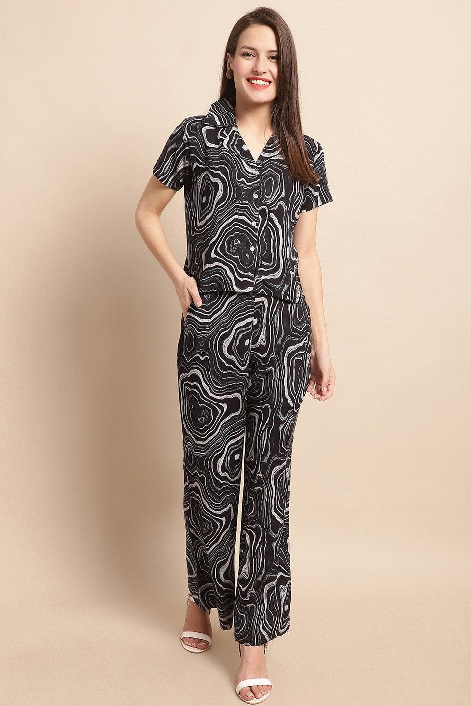 Woman wearing a black abstract print co-ord set 

