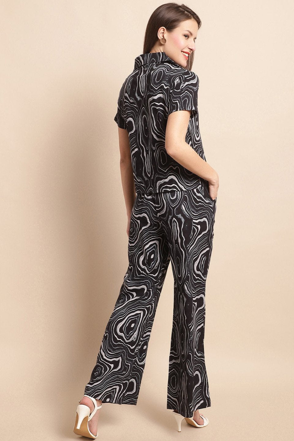 Back view of a model styling the black abstract co-ord outfit
