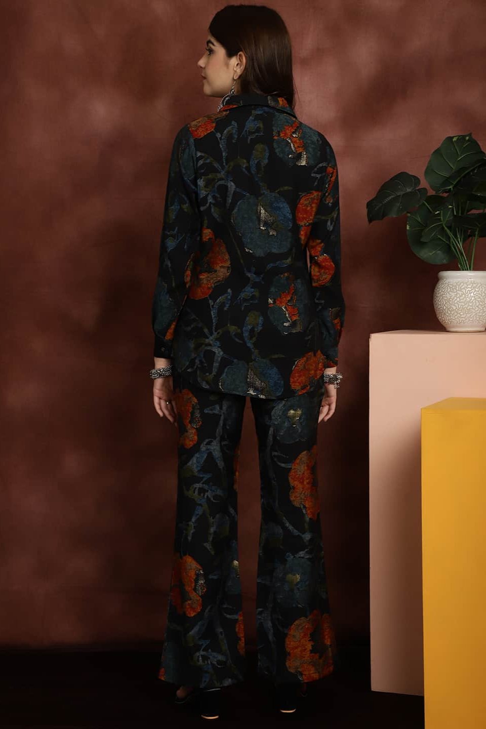 Back view of model styling Navy printed co-ord outfit
