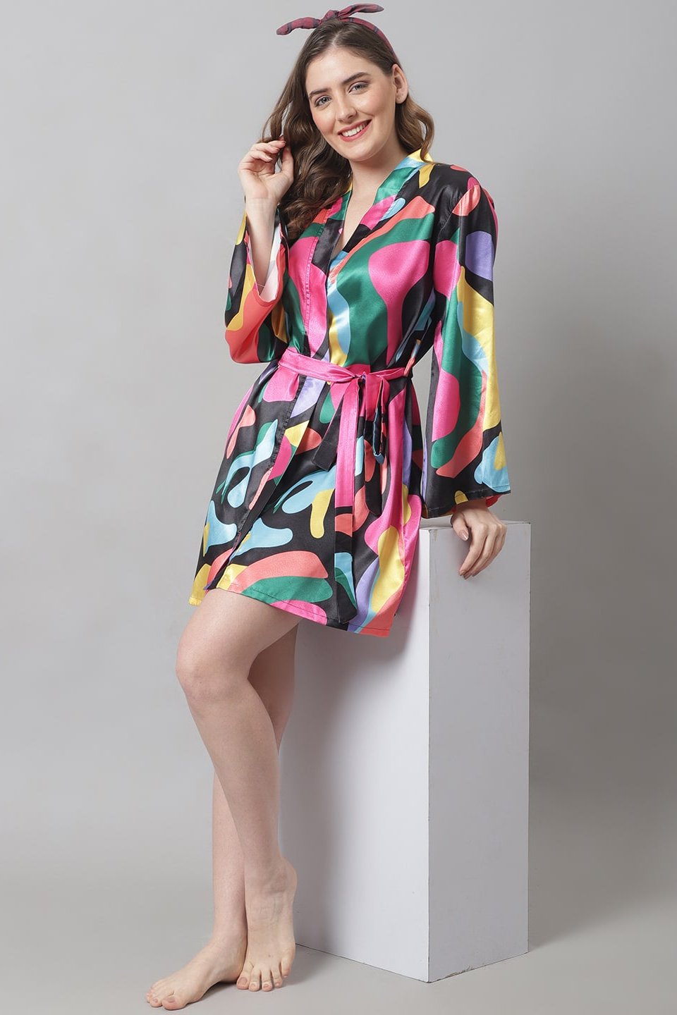 Woman wearing black & pink printed satin beach dress for women